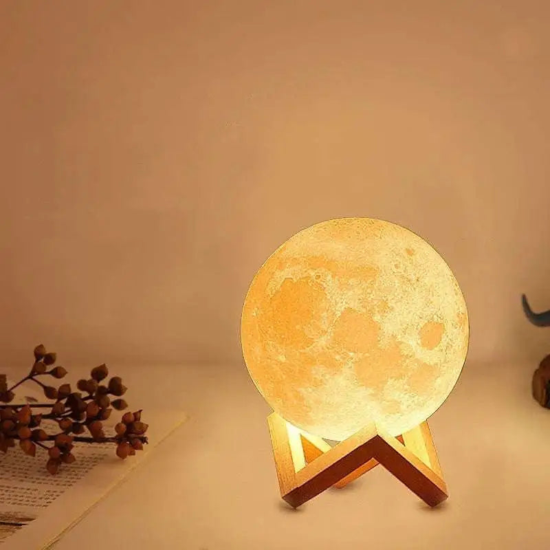Warmly glowing 16-colour remote control moon night table lamp with detailed moon surface and wooden v-shaped stand