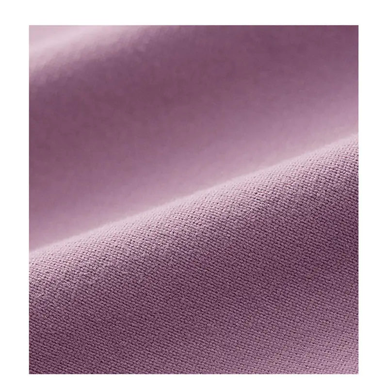 soft lavender-colored mauve crisscross strap long sleeve yoga crop top fabric with a subtle textured weave