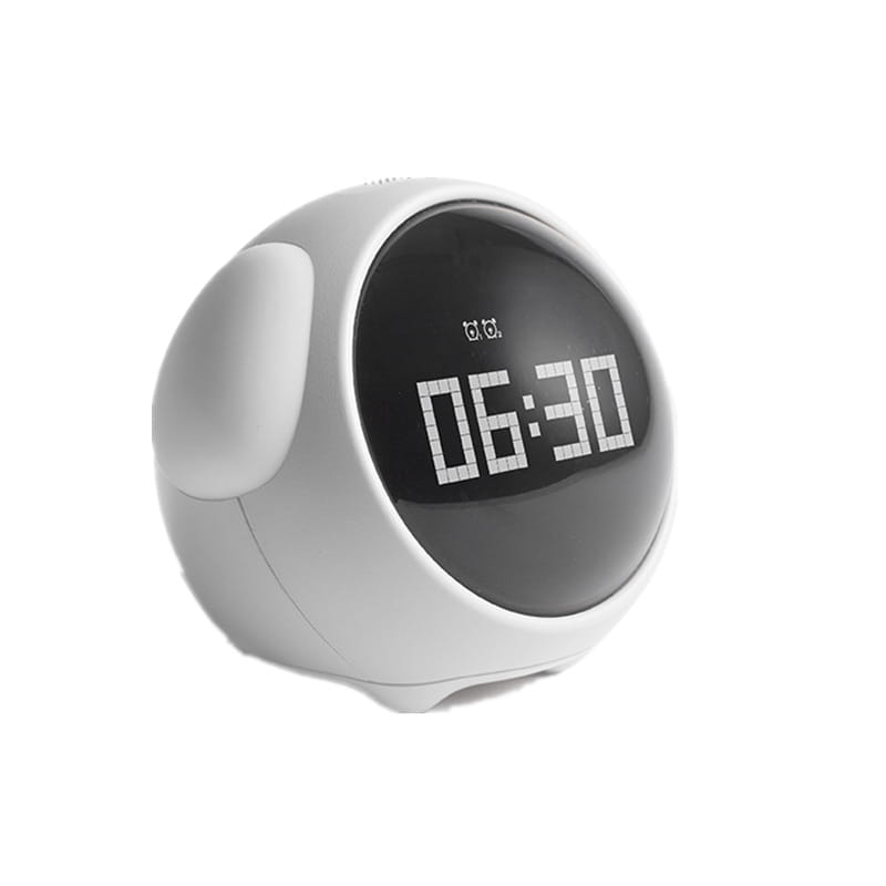 White rounded digital electronic cute alarm clock with black pixel expression display showing 06:30 in pixelated white numerals.
