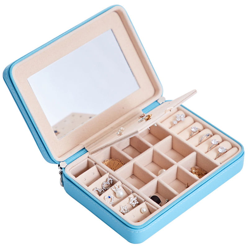 Light blue faux leather multifunctional jewelry storage box with built-in mirror and segmented compartments for storing earrings rings and other accessories.