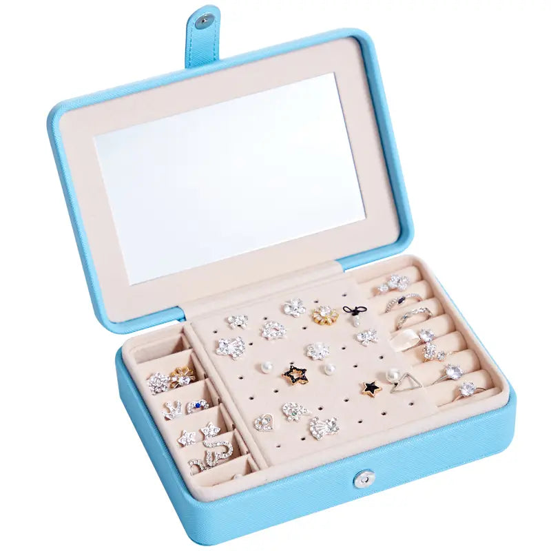 Light blue faux leather multifunctional jewelry storage box with built-in mirror and organized compartments for earrings rings and studs.