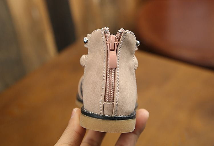 beige suede ankle boot with pink zipper and silver eyelets featuring a light tan rubber sole shown with yards internal length for girls braided beige sandals.