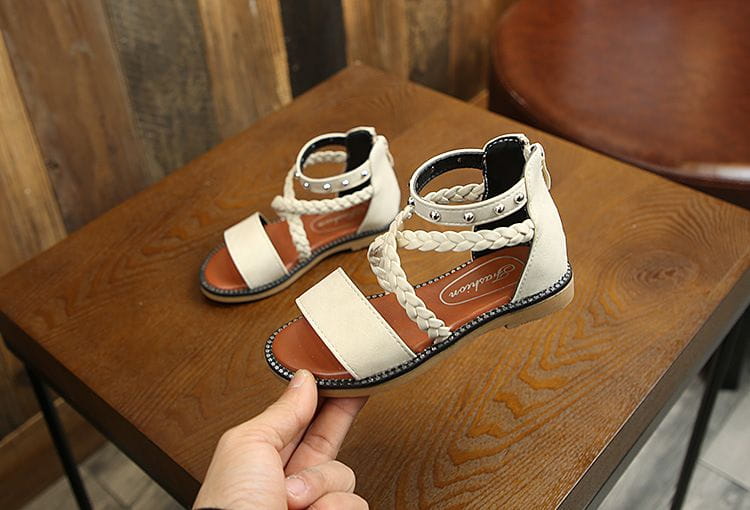 Girls braided beige leather sandals with braided straps and silver studs highlighting the yards internal length for accurate fit measurement.