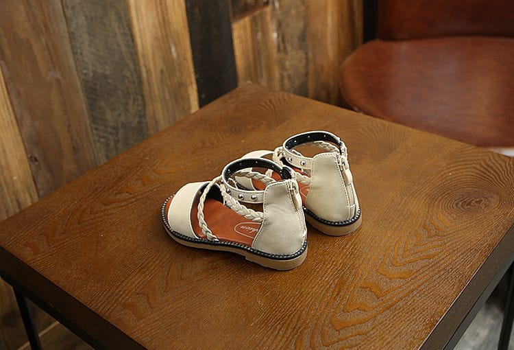 Girls braided beige leather sandals with white braided straps and silver studs featuring yards internal length for accurate sizing.
