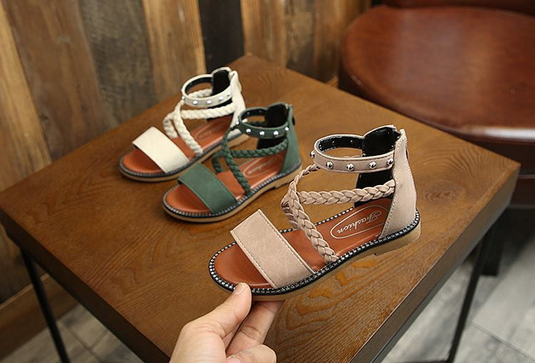 Girls braided beige sandals made of suede and leather with silver studs on the ankle strap featuring yards internal length for an accurate fit.
