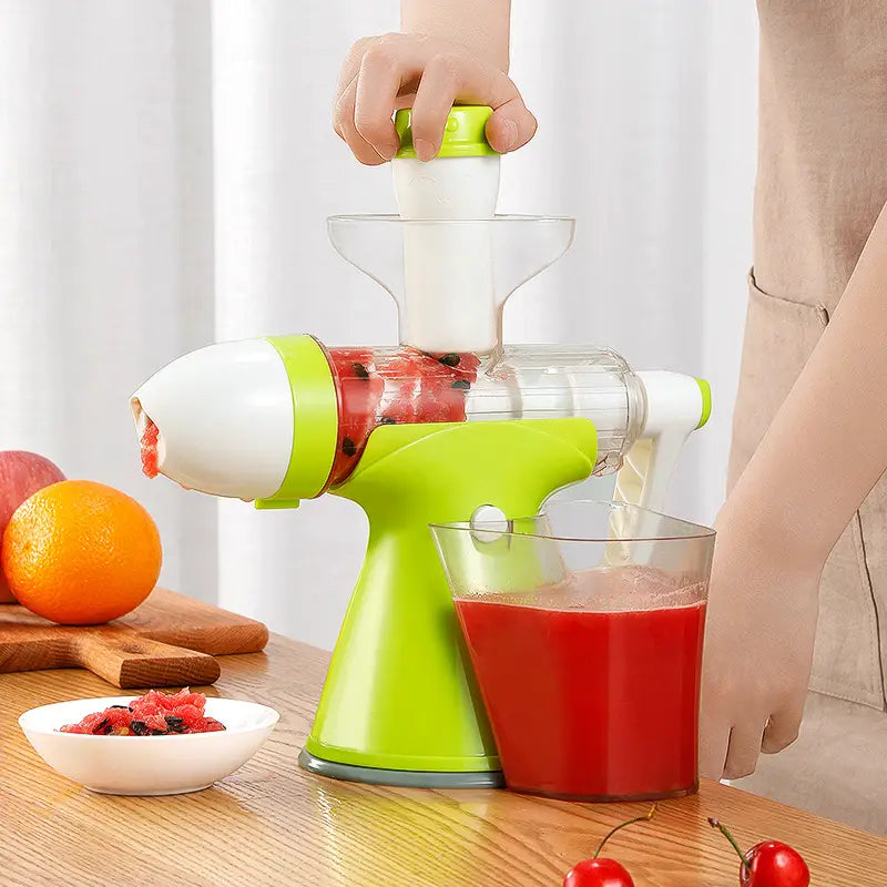 bright green and white small household juicer with a clear juice collection container designed to efficiently squeeze lemon orange juice