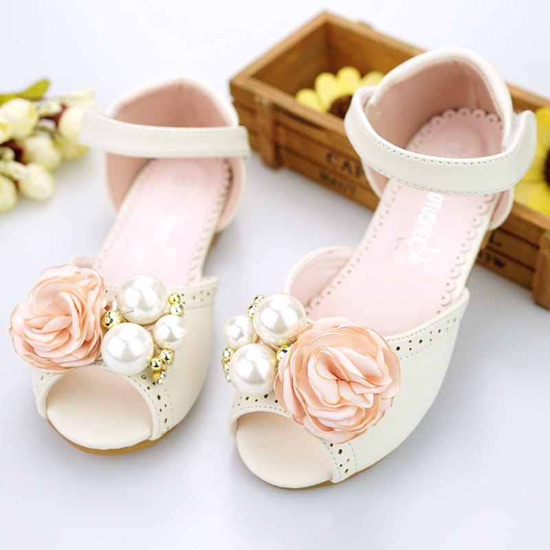 Cream-colored korean style flower princess sandals featuring peep-toe design adorned with peach fabric roses and white pearl clusters accented by gold beads.
