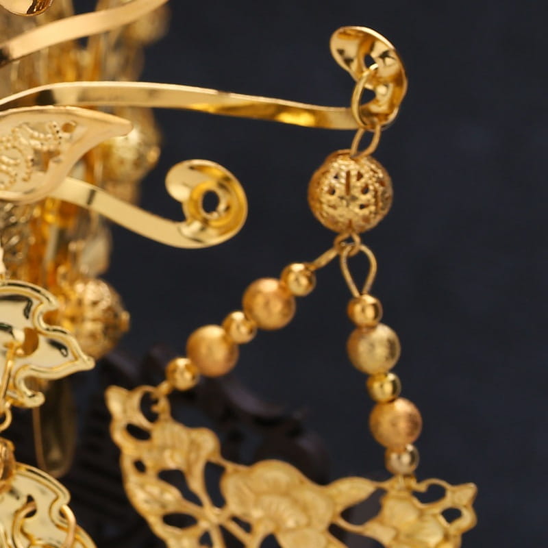 Golden ornate hairpin with intricate filigree design and dangling spherical beads for tassel suit wedding cheongsam hair accessories.