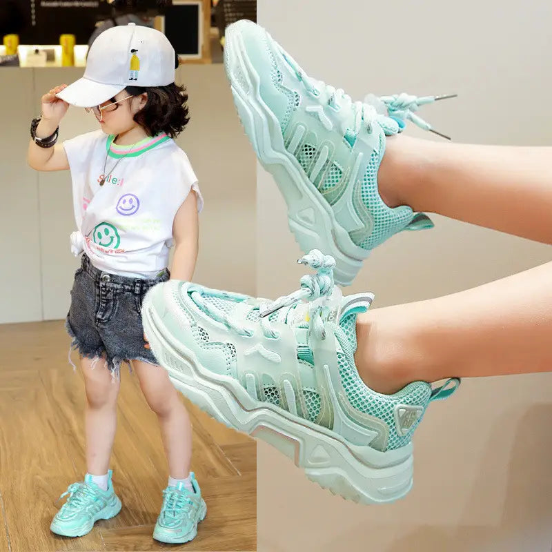 Mint green mesh older children’s casual sports shoes with chunky white soles and matching laces for everyday wear.