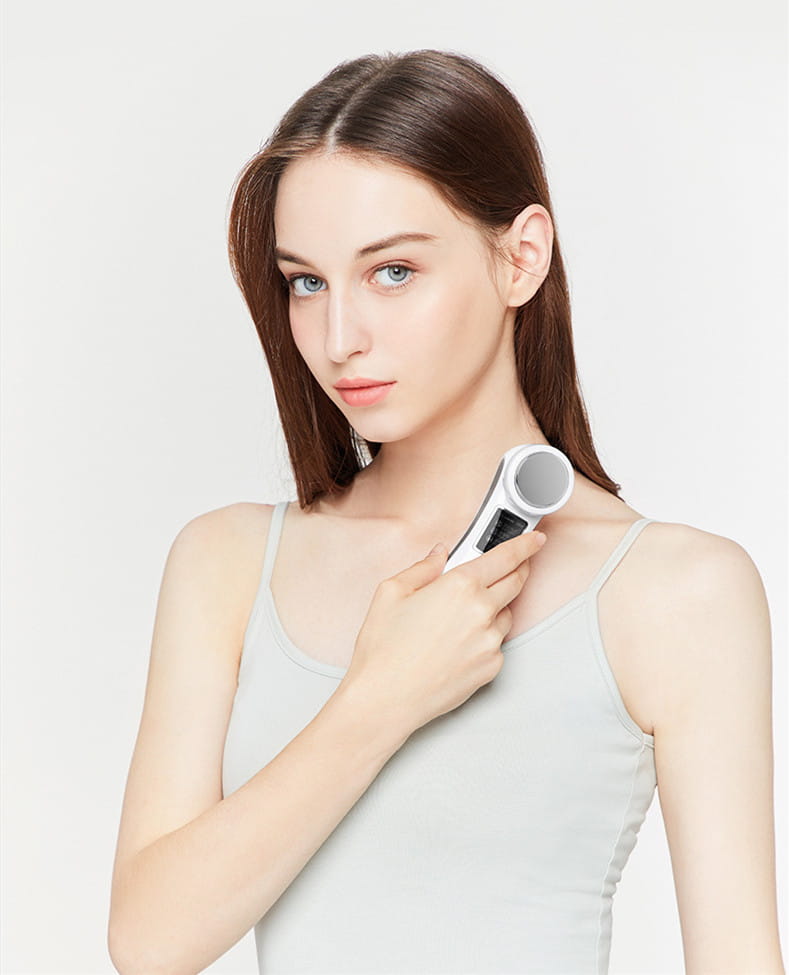 white and silver handheld digital iontophoresis personal care device with a sleek modern design for care negative iontophoresis treatment