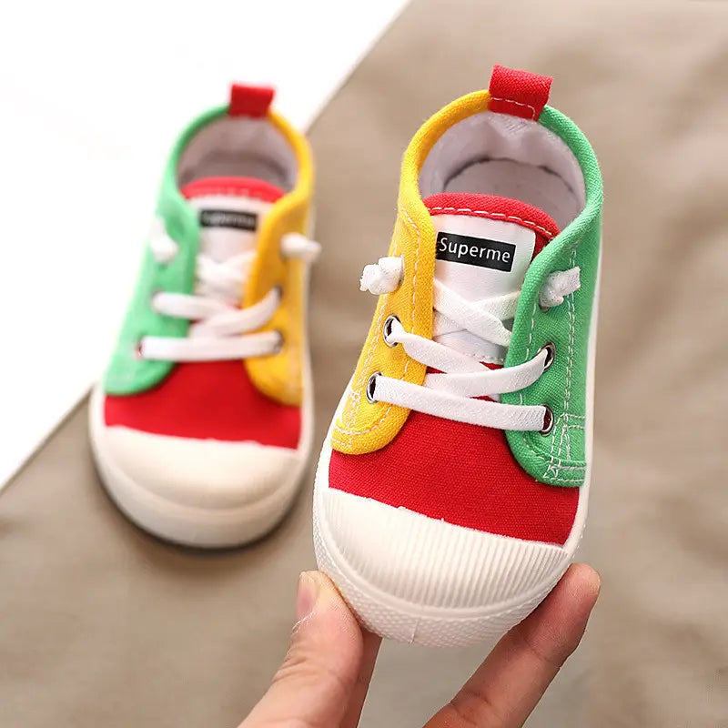 colorful kindergarten indoor shoes with rubber soles featuring brightly colored red yellow and green canvas panels with white laces designed for indoor shoes baby and optimized for yards-inner length.