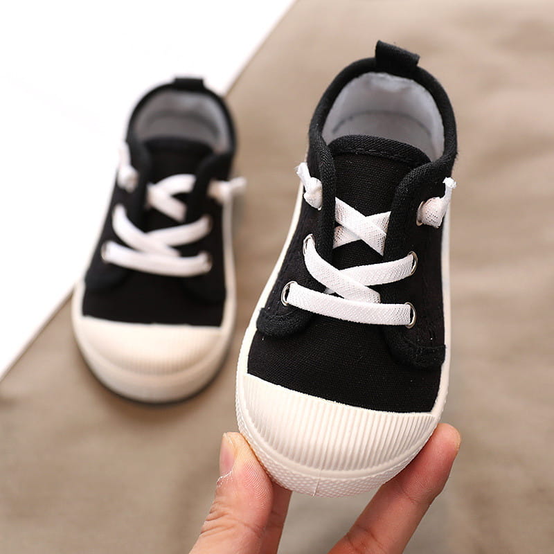 black canvas toddler sneakers with white laces and ribbed rubber soles designed as colorful kindergarten indoor shoes with rubber soles suitable for indoor shoes baby and yards-inner length measurement