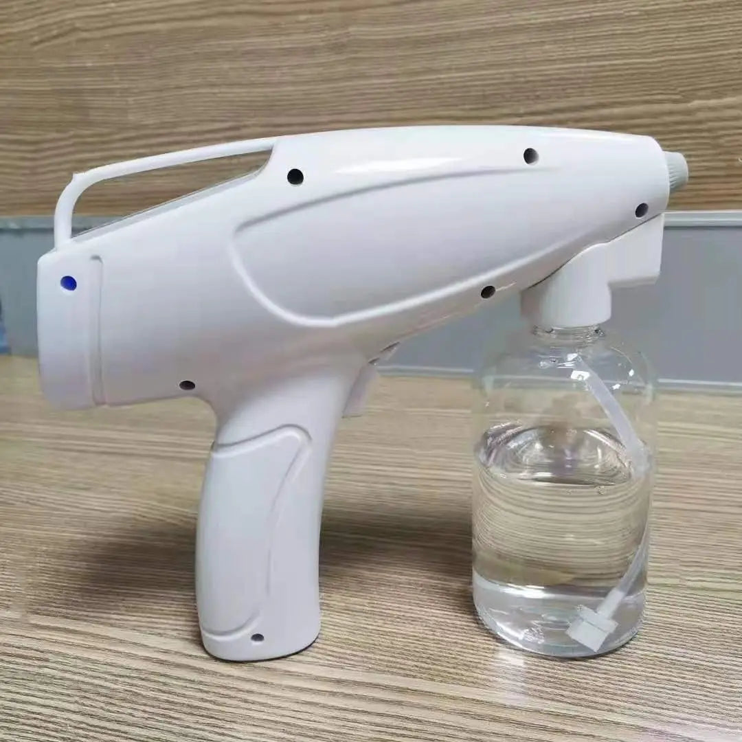 White plastic wireless electric sprayer disinfection gun with a clear liquid reservoir attached for efficient disinfecting.