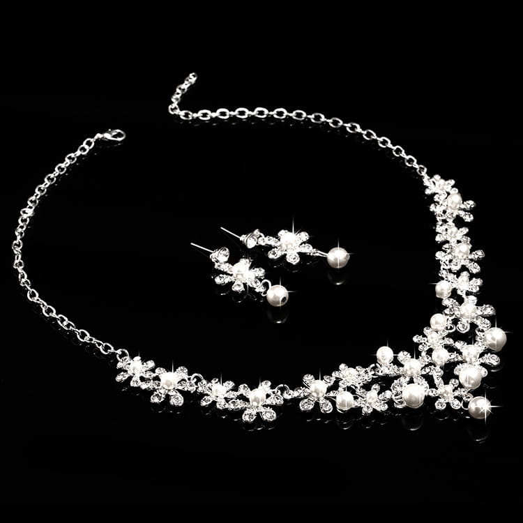 silver floral necklace with sparkling crystals and pearl accents as part of an alloy headdress bridal crown and earrings set