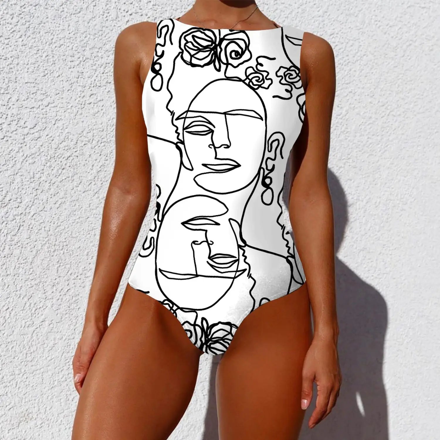 white one-piece swimsuit with a bold black vintage abstract print featuring line-art faces and roses perfect for fashion vintage abstract and abstract print lady styles