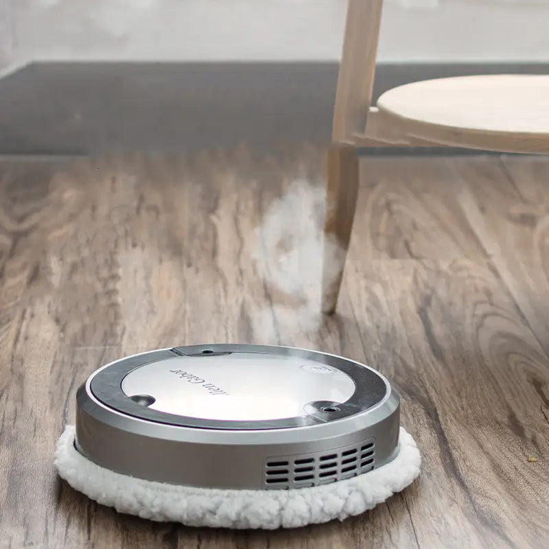 Silver white intelligent automatic sweeping robot in silver and gray with a white fuzzy cleaning pad for efficient intelligent automatic sweeping and sweeping robot functionality.
