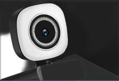 White and black square-shaped model 4k live computer camera with a circular lens surrounded by a ring of led lights for live broadcast beauty use.