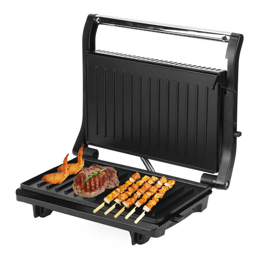Black nonstick electric grill and steak maker with ribbed cooking plates and a stainless steel handle cooking steak shrimp and chicken skewers on its surface.