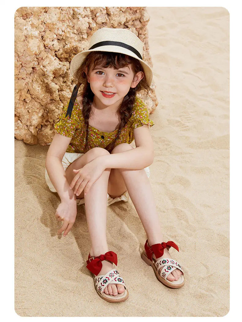 beige big children’s soft-soled sandals featuring red bows and embroidered floral designs for baby children’s shoes