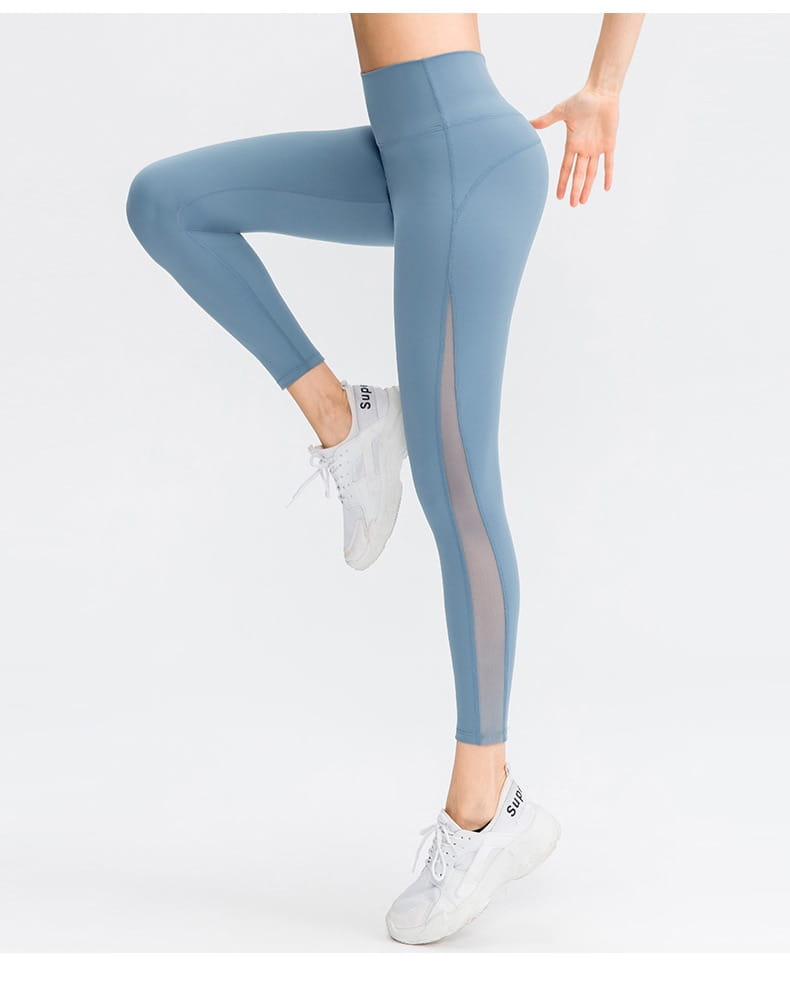 a pair of light blue women seamless high waisted yoga pants featuring sheer side panels designed as butt lifting workout leggings for enhanced lifting workout performance