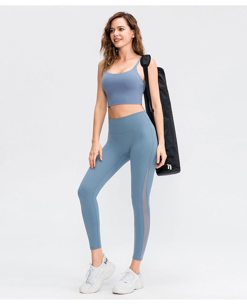 A sleek light blue women seamless high waisted yoga pants set featuring a crop top and butt lifting workout leggings with mesh side panels.