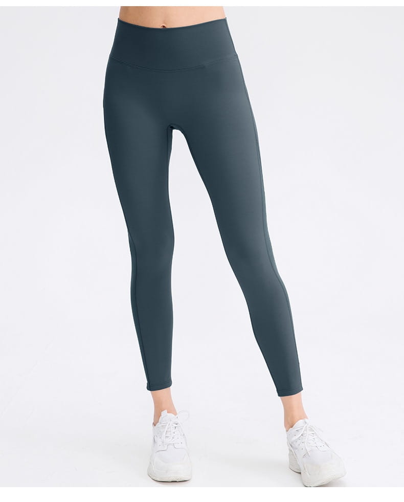 dark gray high-waisted women seamless high waisted yoga pants made of smooth stretchy fabric designed as lifting workout leggings for butt lifting workout.