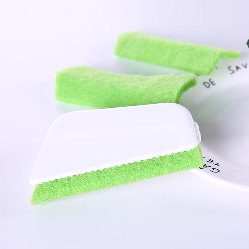 Bright green soft-textured sponge scrubber with white plastic handle gap brush designed for cleaning window grooves and efficient cleaning window maintenance.