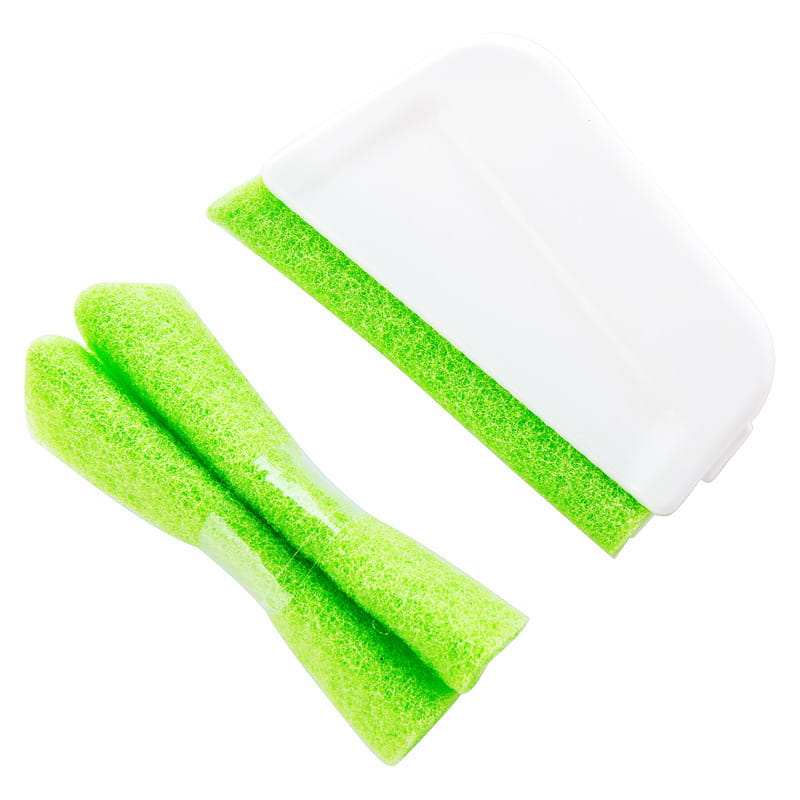 Bright green sponge scrubber with white plastic handle gap brush designed for cleaning window grooves and cleaning window edges.
