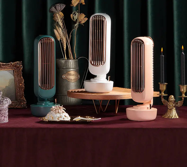 Three sleek humidification tower fans in pastel pink white and teal with rose gold accents designed for personal air cooling on desktops.