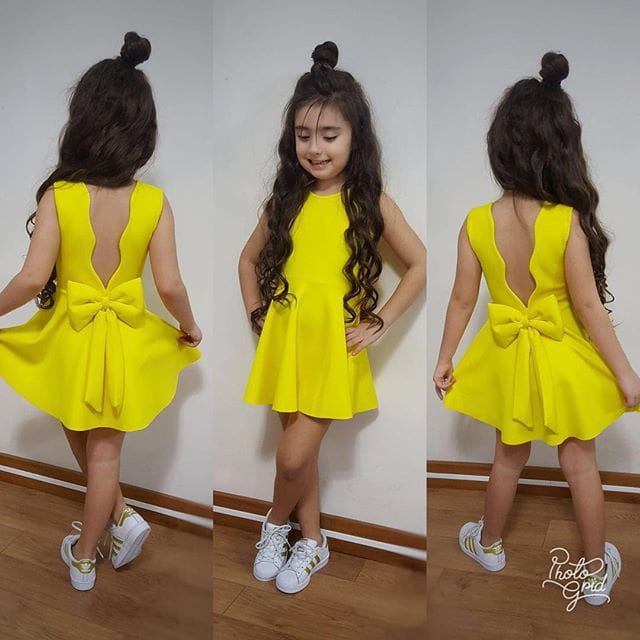 royal blue summer girls sleeveless princess dress shown from the back featuring a bright yellow sleeveless design with a bow and cutout detail ideal for clothing summer girls.