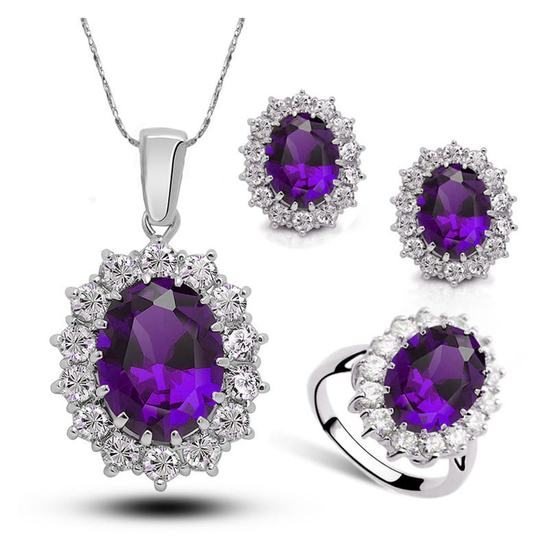 Elegant silver-toned crystal jewelry bridal necklace earrings and ring set featuring a central oval amethyst stone surrounded by sparkling clear crystals.