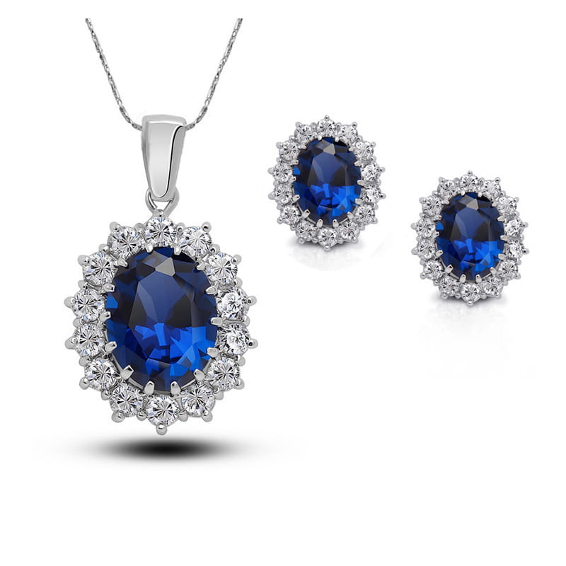Elegant turquoise crystal jewelry bridal necklace and earrings set featuring oval-cut deep blue sapphire and diamond pendant surrounded by sparkling clear stones in polished silver-toned metal.