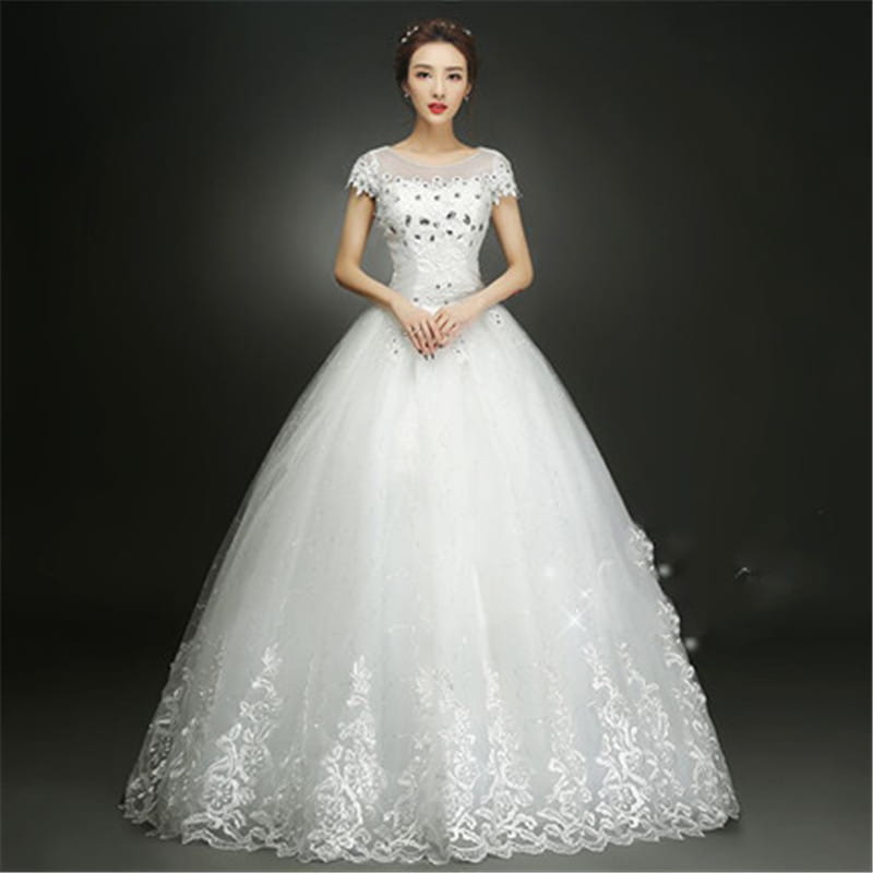 Elegant white floor length wedding dress with intricate lace detailing and beaded embellishments perfect for a wedding wedding dress occasion