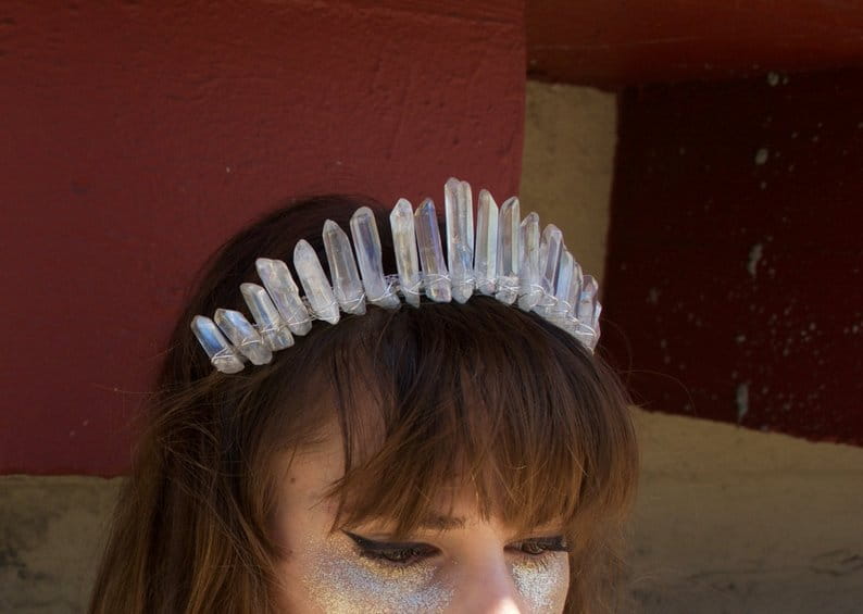 A sparkling iridescent quartz crown headband hair accessory featuring clear faceted quartz points arranged in a regal curve ideal for bridal hair accessories.