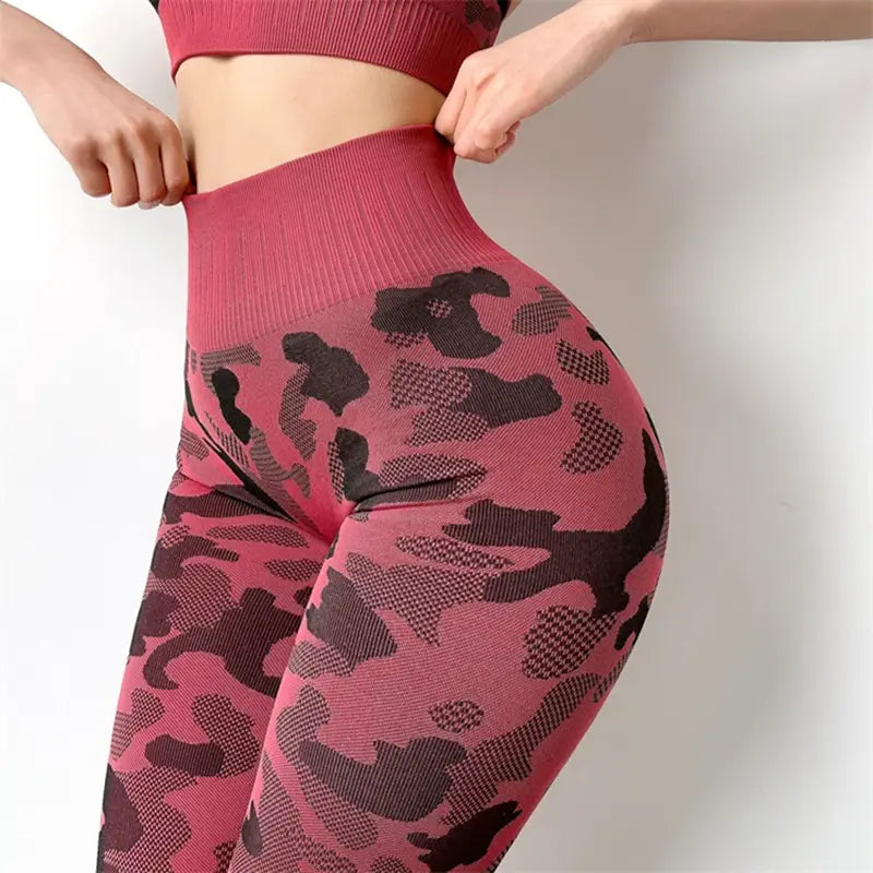 High waist pink and black camouflage patterned fitness pants stretch with a ribbed waistband for hip lifting and support.