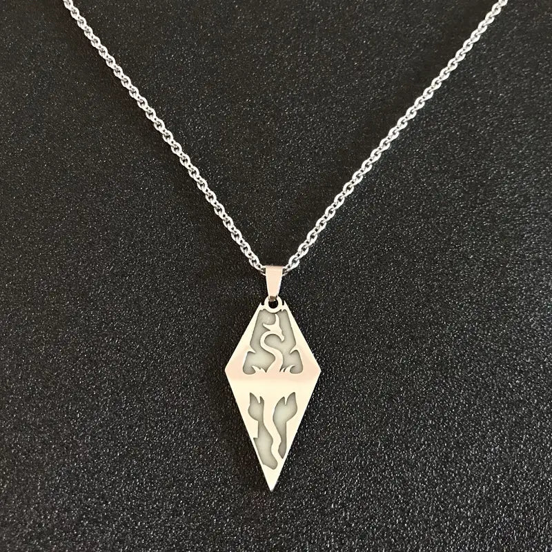 silver diamond-shaped titanium steel luminous necklace with intricate dragon and flame cutouts on a sleek stainless steel chain designed as a luminous necklace couple jewelry