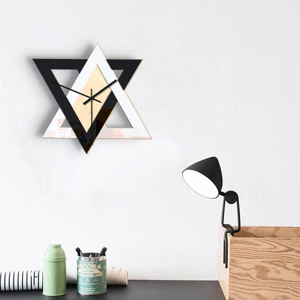 Nordic personality black and white creative wall clock featuring a geometric design with mirrored triangular elements and a minimalist style.