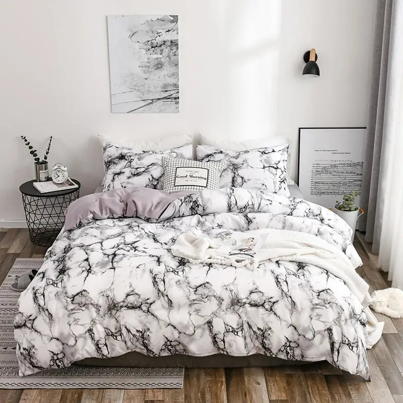 white and black marble-patterned bed sheets set quilt with a soft textured fabric finish in a set quilt duvet cover design