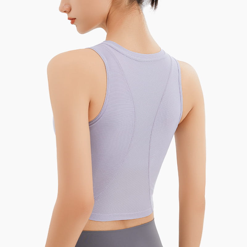 A lavender ribbed sleeveless fitness vest with a chest pad featuring a form-fitting design and subtle texture for athletic use.