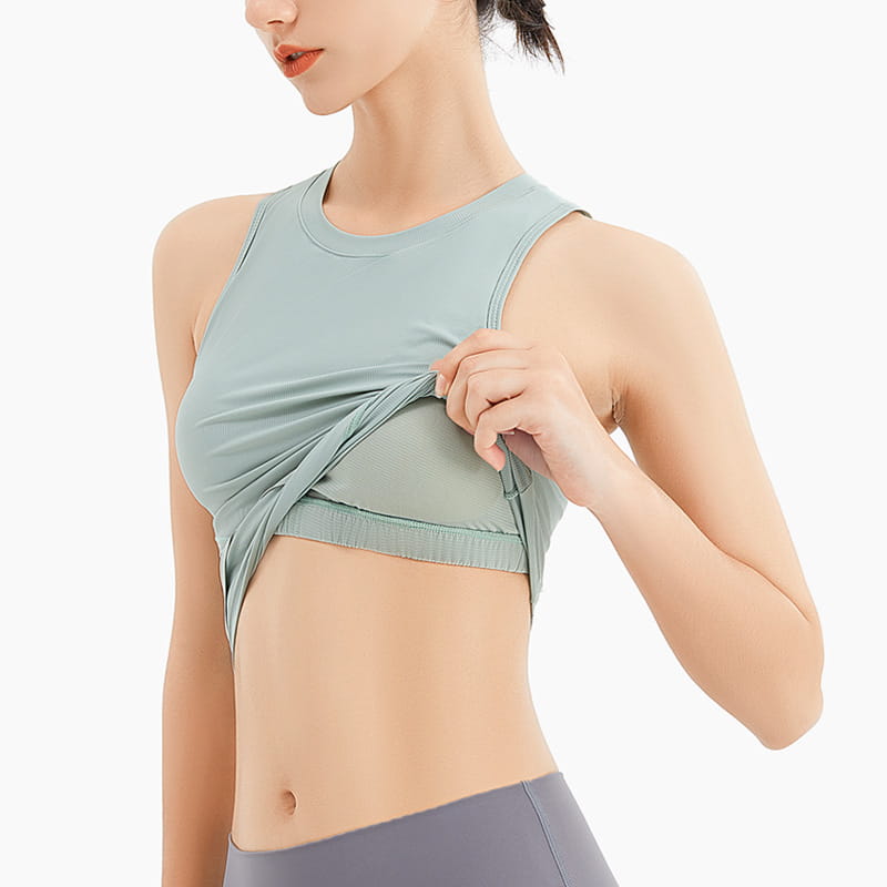 A light green sleeveless fitness vest with a round neckline, ribbed texture, elastic band, and chest pad designed for activewear.