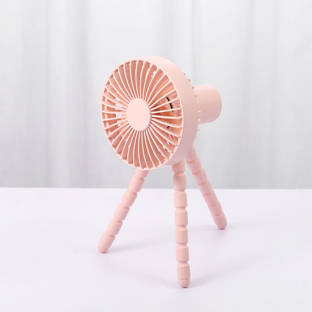 Pink plastic tripod small fan with circular blade design designed as a multifunctional small fan desktop adjustable for versatile use