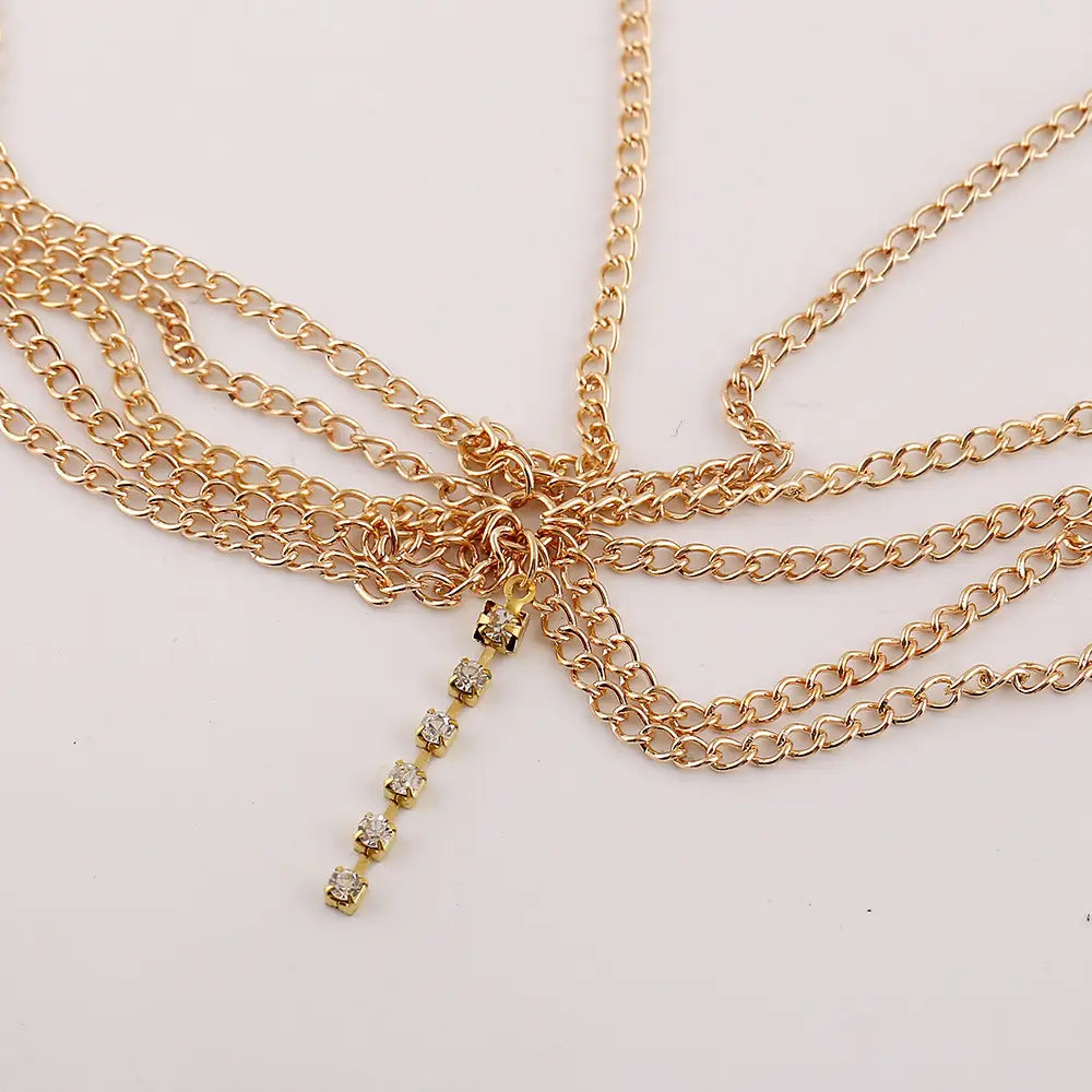 gold-toned head chain featuring multiple layered tassel inlaid diamond chains with a dangling row of clear rhinestones for elegant hair adornment