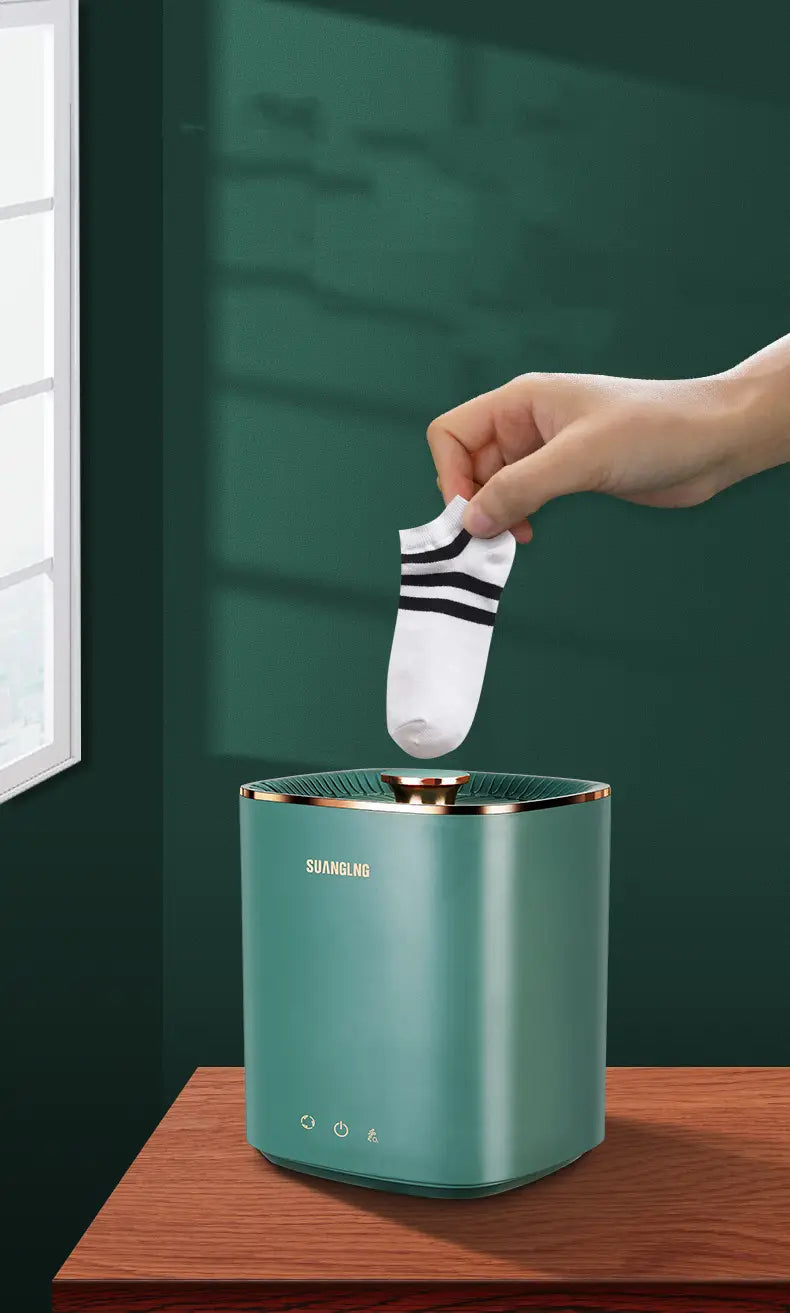 teal mini portable washing machine with sufanging sock dehumidifier in teal color and gold trim featuring a minimalist design for effective mini portable washing use