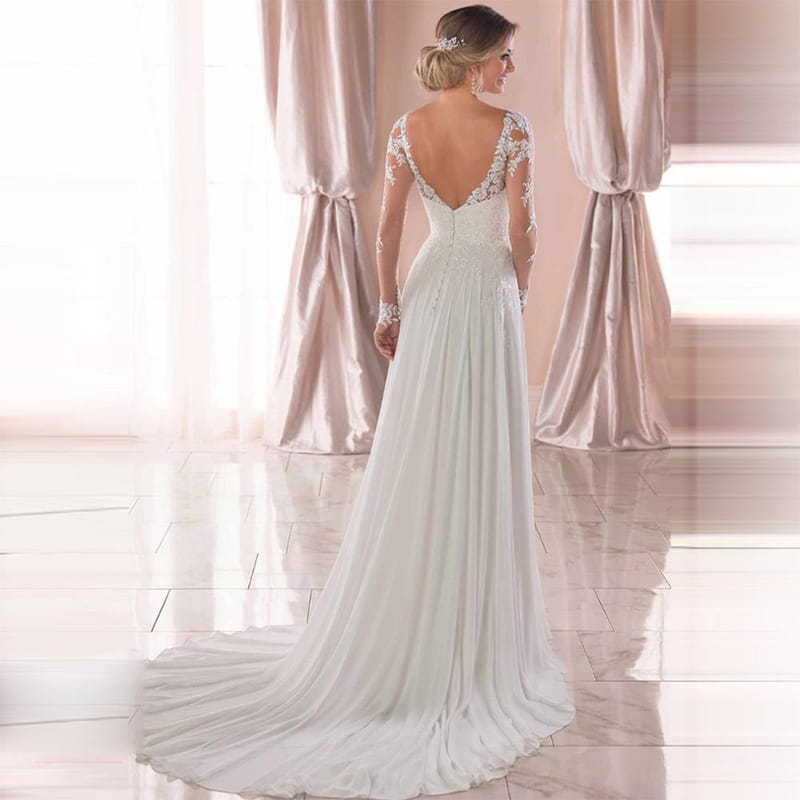 A white lace wedding dress with long sleeves, a flowing train, and a sexy backless deep V-neck design perfect for formal occasions.