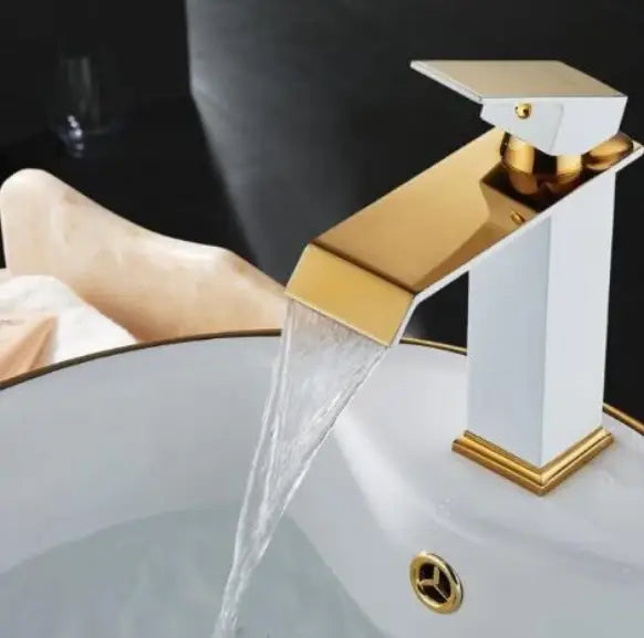 white and gold cold water waterfall basin faucet with a sleek angular design and modern finish