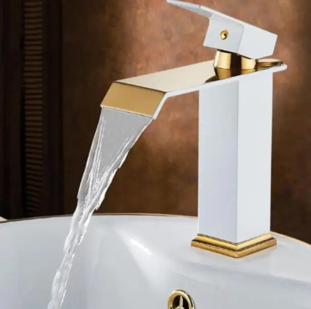 White and gold modern basin faucet with a sleek rectangular design featuring a cold water waterfall for basin use.