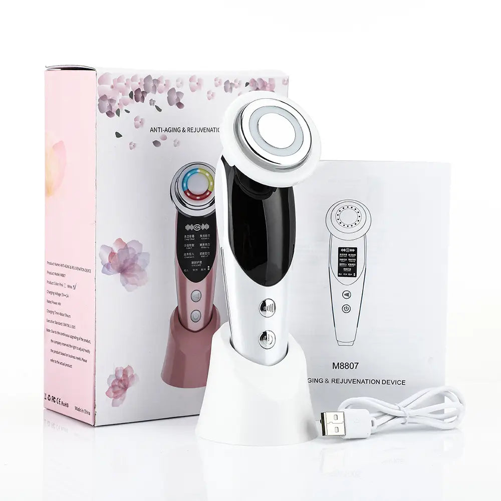 White and black 7-in-1 facial massager EMS device with circular treatment head and digital display featuring color light vibration and light vibration LED technology for anti-aging care