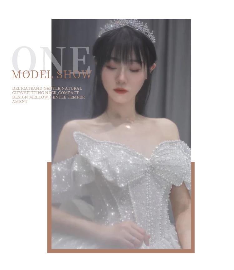 A sparkling white one-shoulder long trailing heavy industry wedding dress adorned with sequins and ruffled detailing.