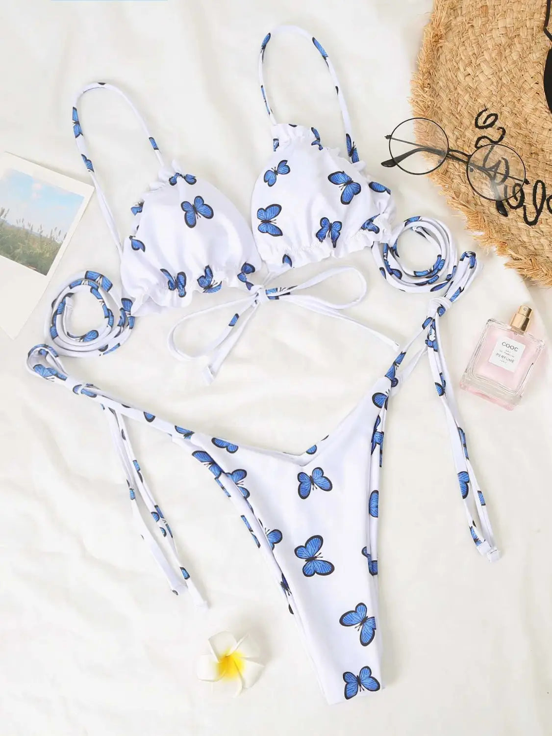 white butterfly print swimsuit lace thong bikini featuring a white bikini set with blue butterfly print and adjustable tie-side straps.
