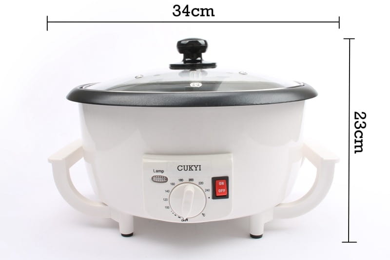 White electric coffee roasting machine with black lid and handles, featuring a temperature control dial and red power button for precise coffee roasting.